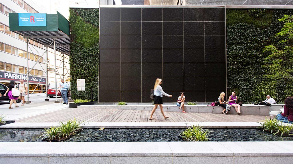 A person walking on a sidewalk.