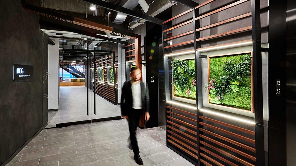 A person walking in a hallway.