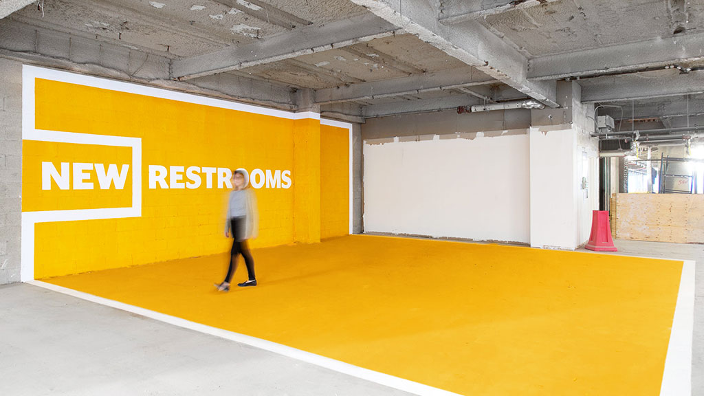 A man walking in a warehouse.