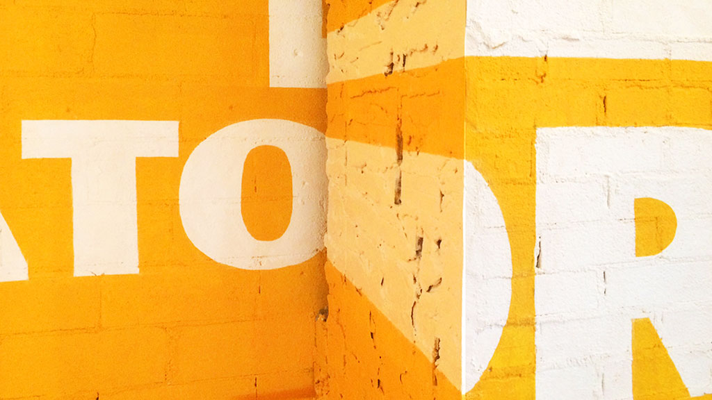 A yellow and white wall.