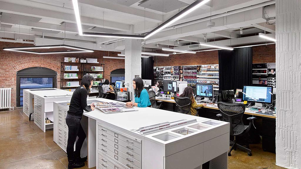 A few people in an office.