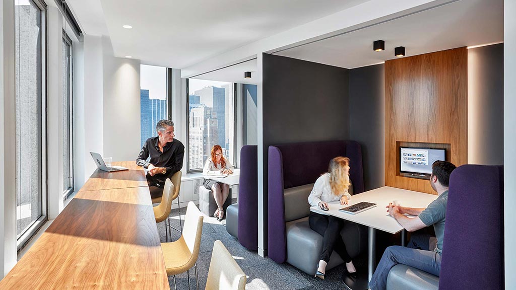 A group of people sitting around a table.