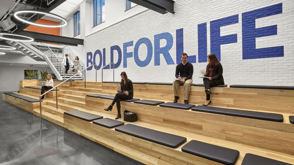 A group of people sitting on a stage.
