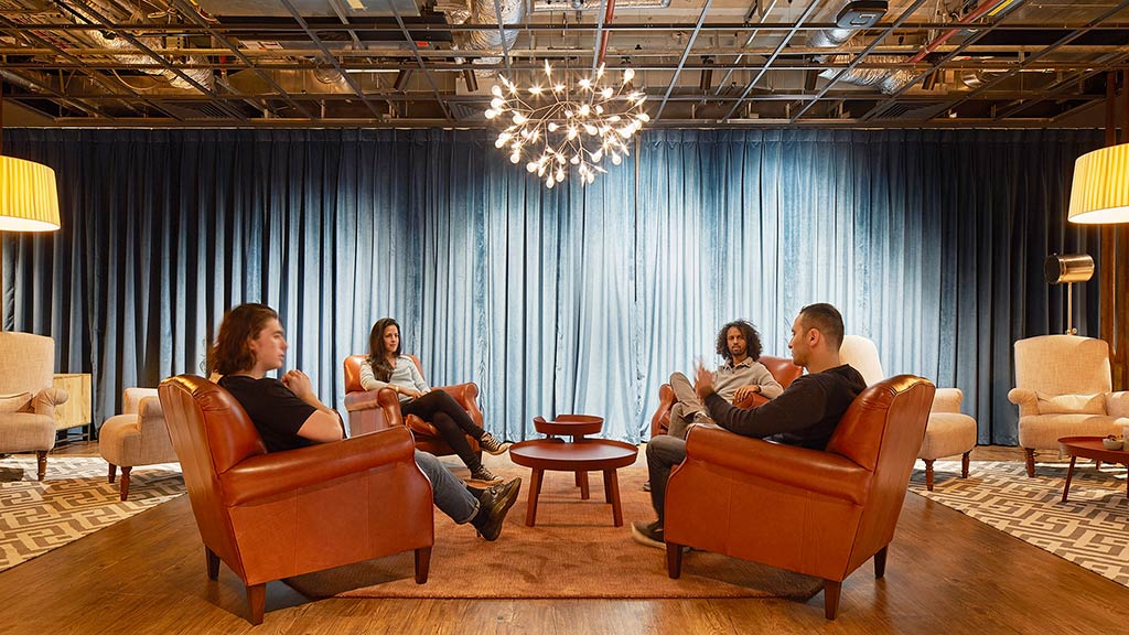 A group of people sitting in chairs.