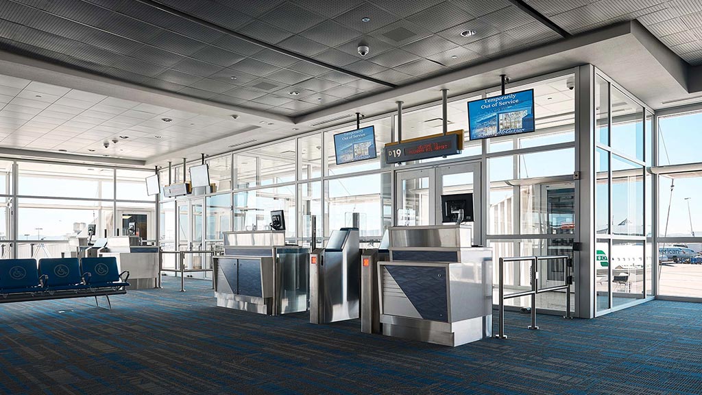 A large room with glass walls and a large blue floor.