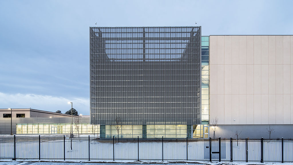 A building with a fence in front of it.