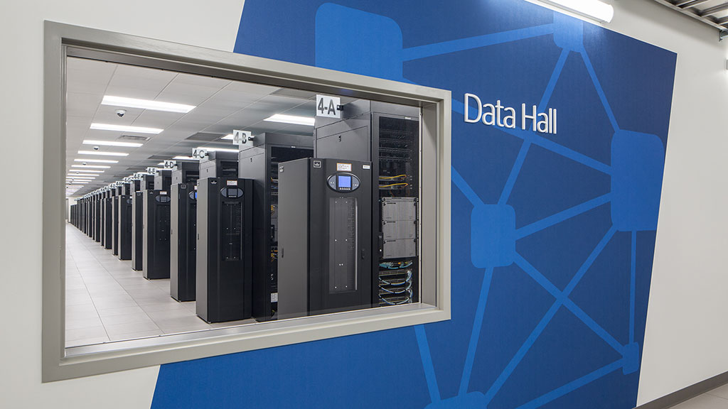 A wall with a computer on it.