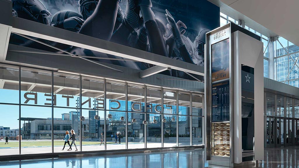 A large metal object with a person standing in the front.