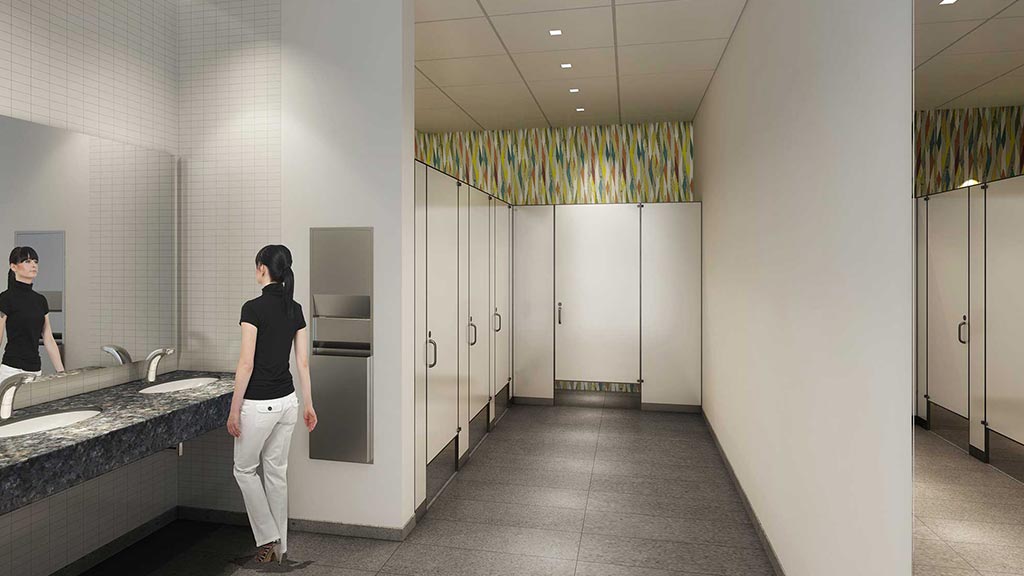A person standing in a bathroom.