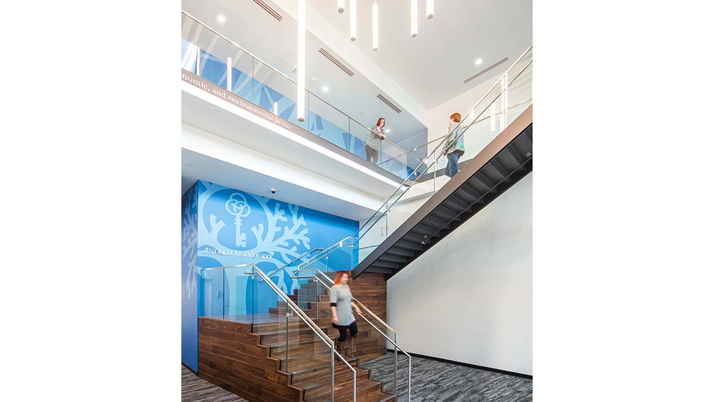 People walking up a flight of stairs.