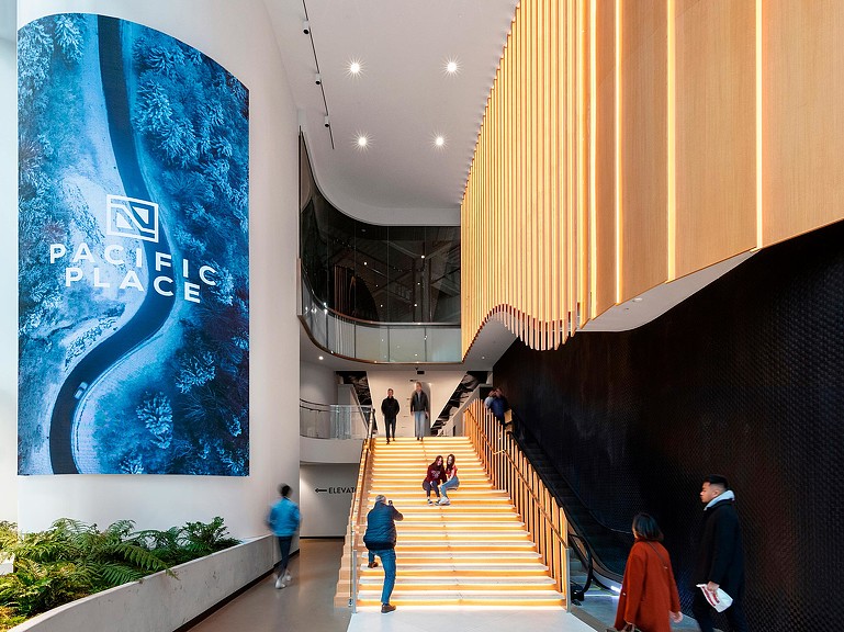 People walking up a flight of stairs.