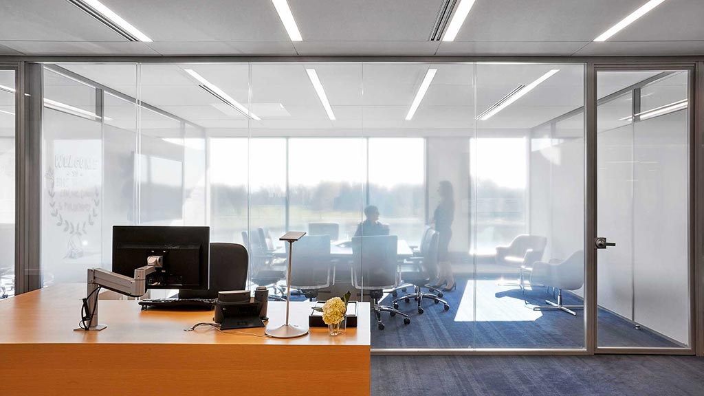 An office with a large glass wall.