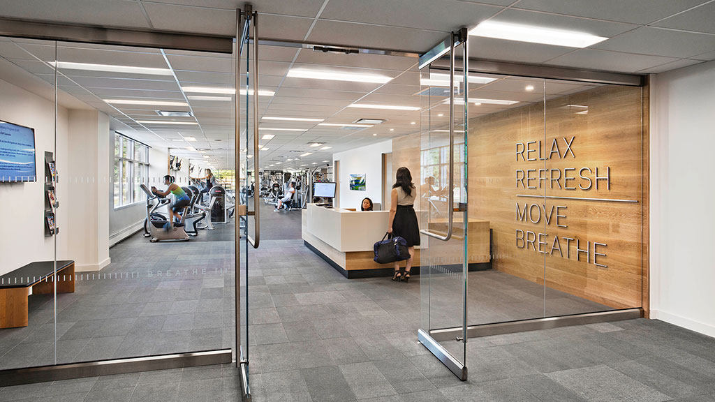 A person sitting at a desk in a large office.