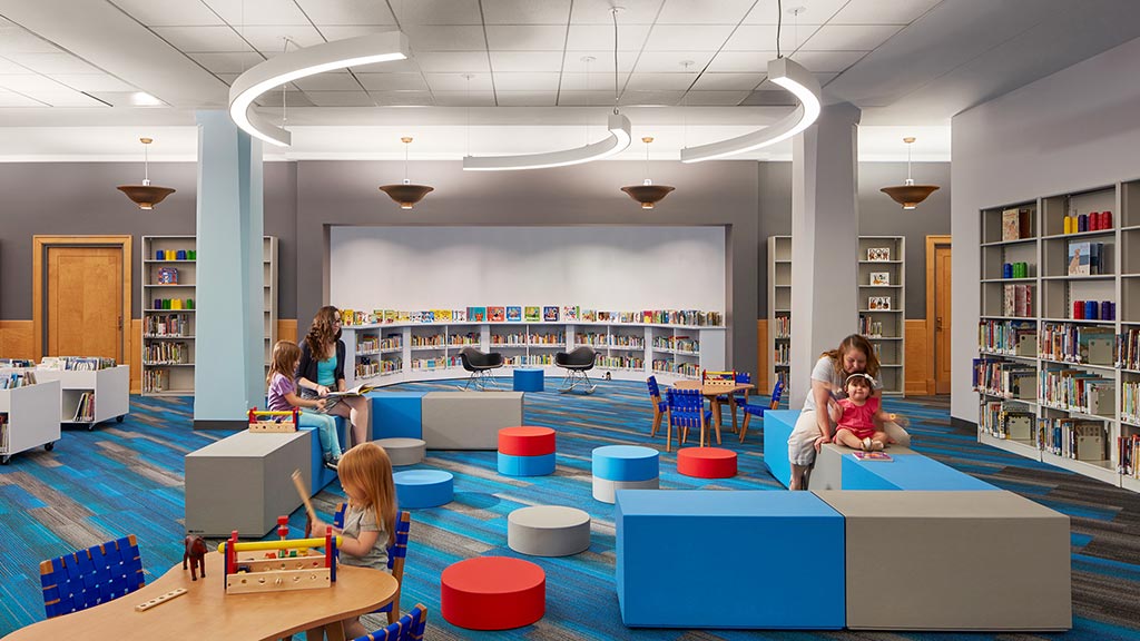 A group of people in a library.
