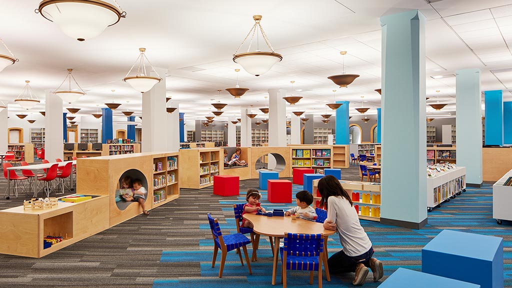 A group of people sitting at tables.