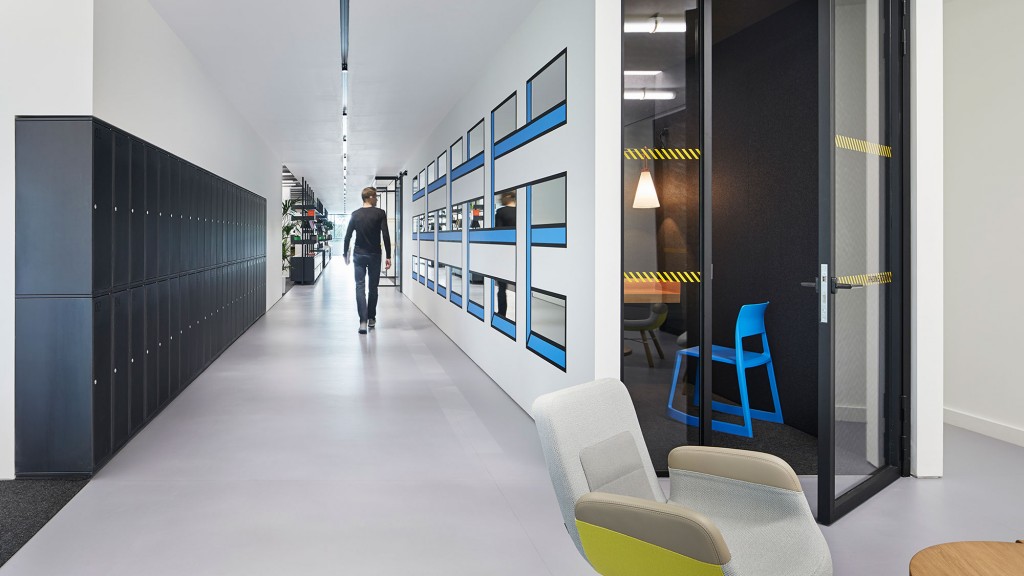 A person walking down a hall.