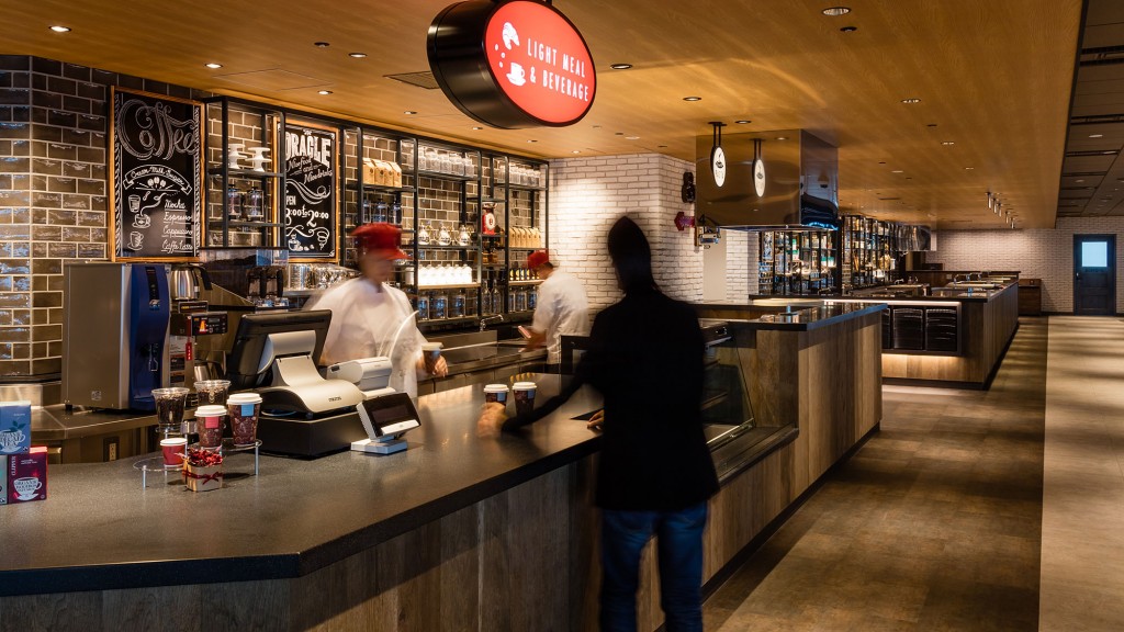 A person standing at a counter.