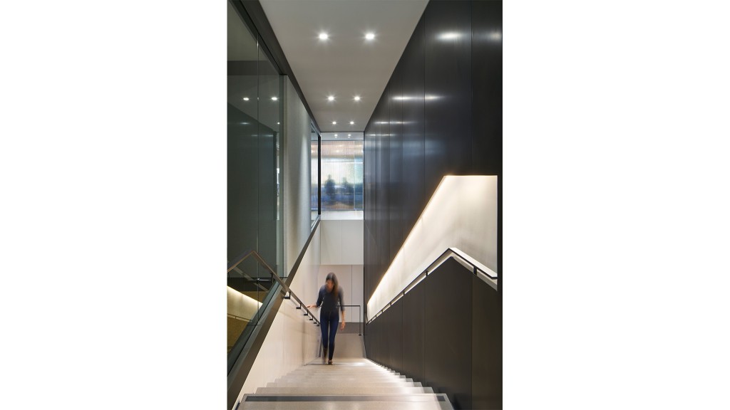 A person walking down a hall.