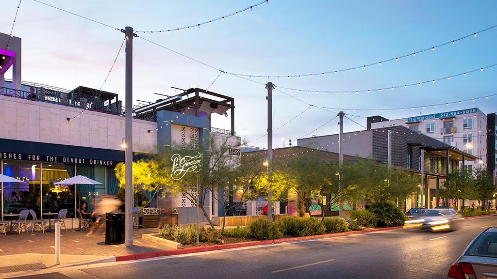 A street with buildings and cars.