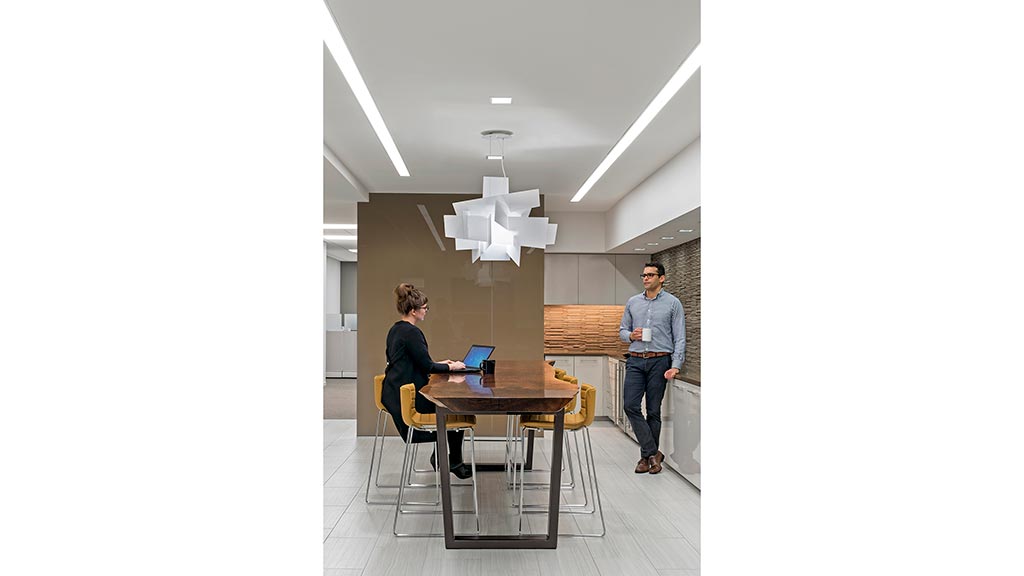 A man and a woman in an office.