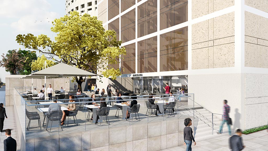 People sitting at tables outside a building.