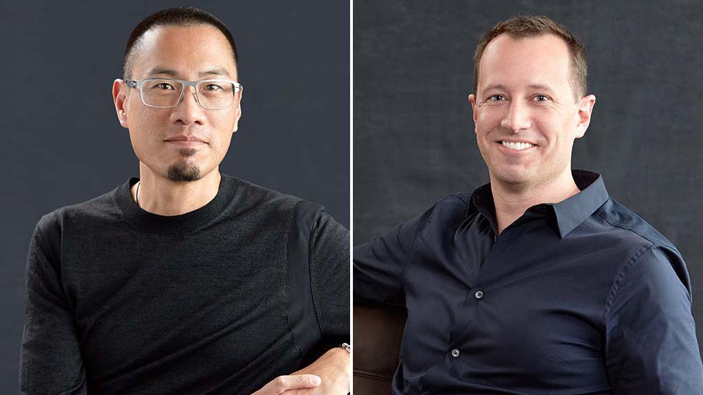 A couple of men posing for the camera.