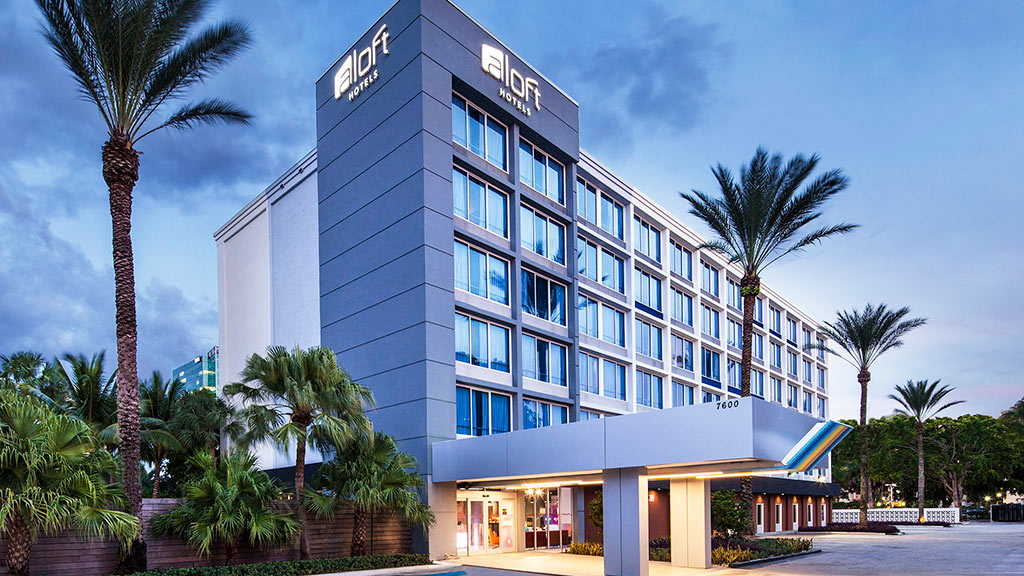 A building with palm trees.