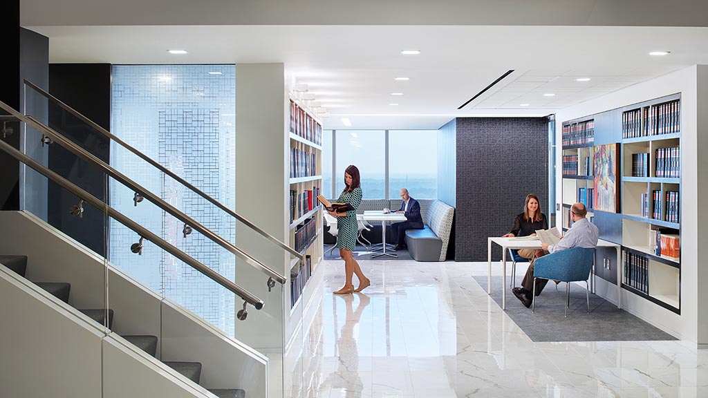 A group of people in a library.