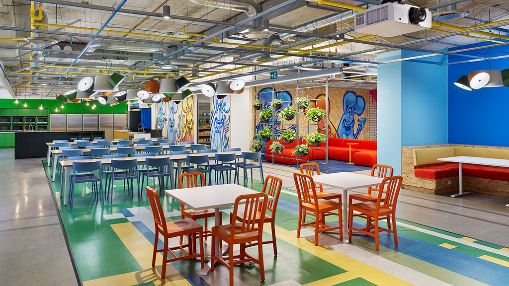 A room with tables and chairs.