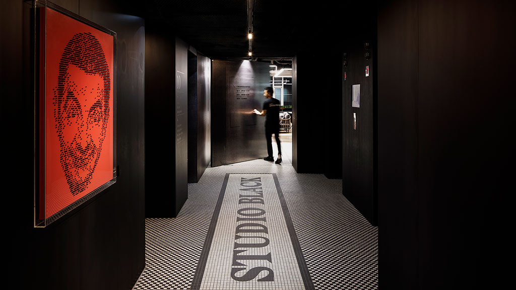 A person walking down a hallway.