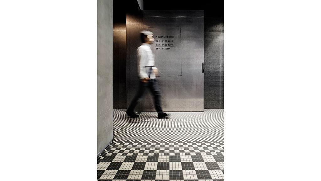 A person walking in a hallway.