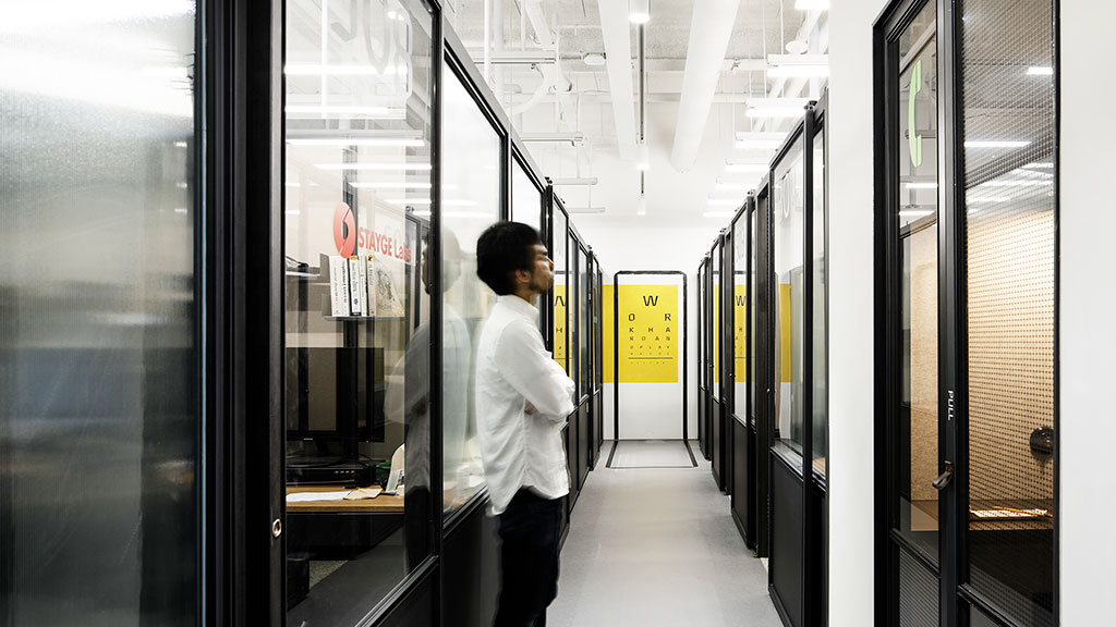 A person standing in a hallway.