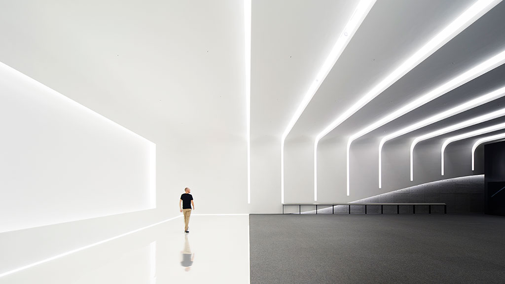 A person walking in a room.