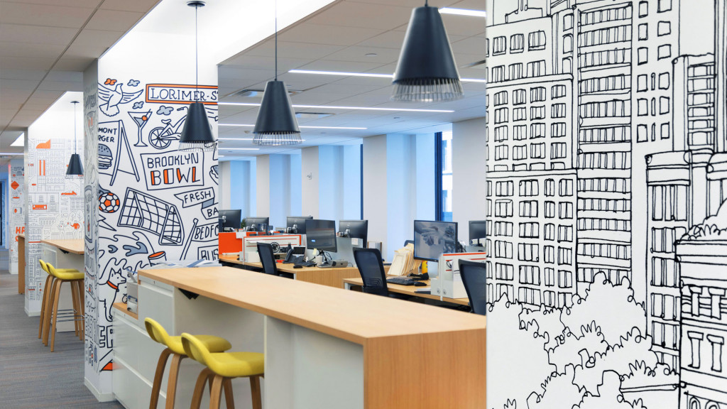 A room with a desk and computer.