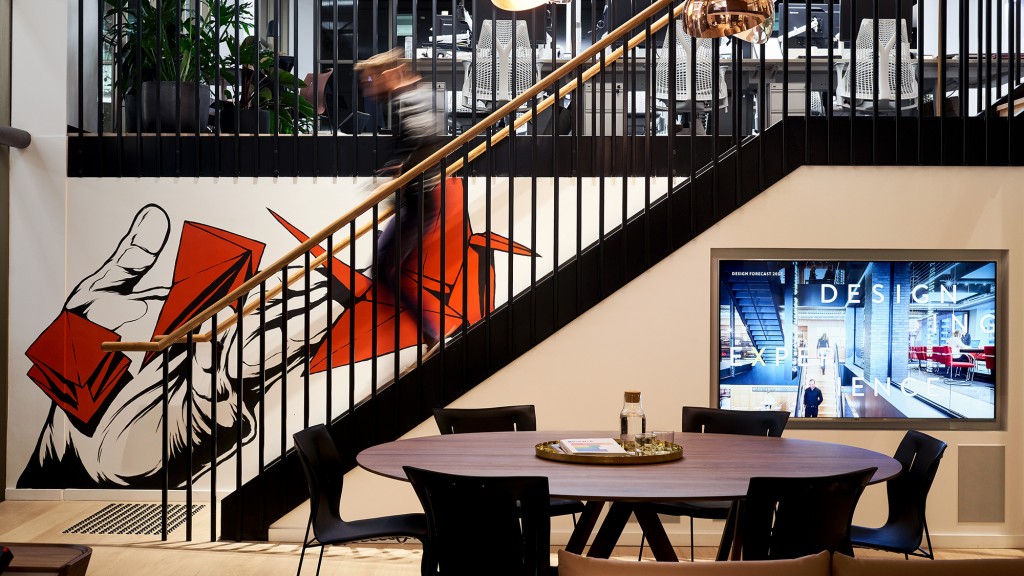 A room with a table and chairs.