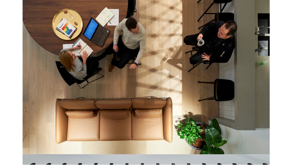 A group of people working on a laptop.