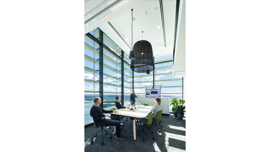 A group of people sitting around a table.