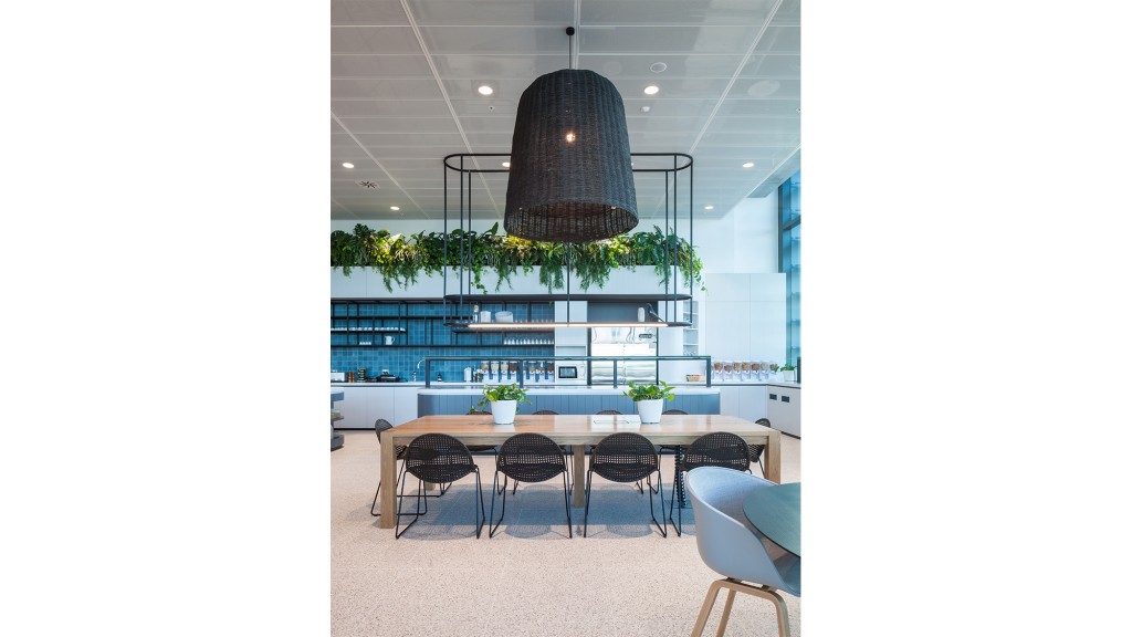 A room with a table and chairs.