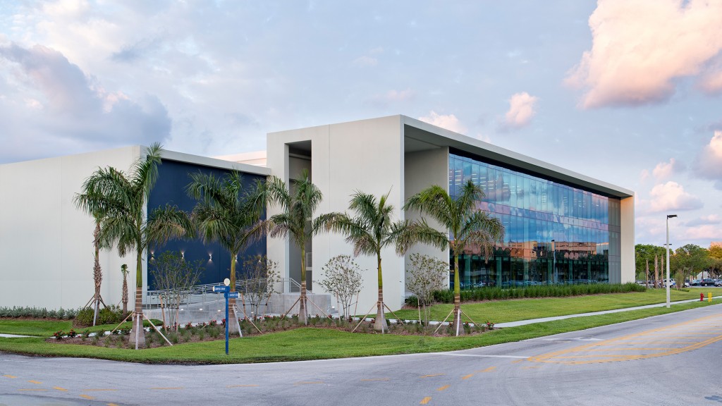 A building with palm trees.