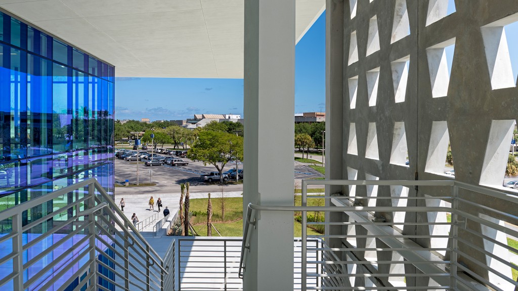 A view of a parking lot from a high rise building.