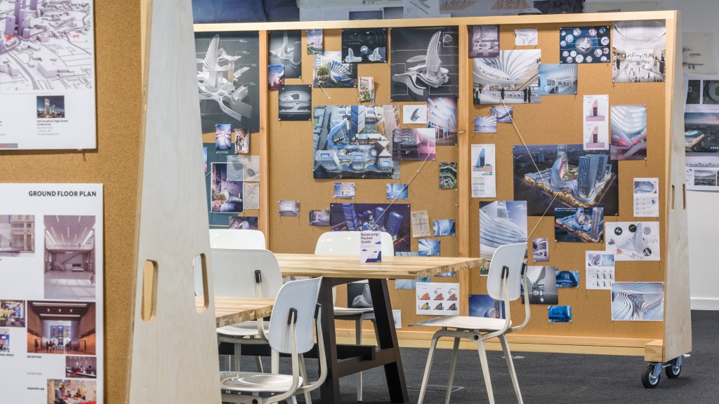 A room with a wall of posters.