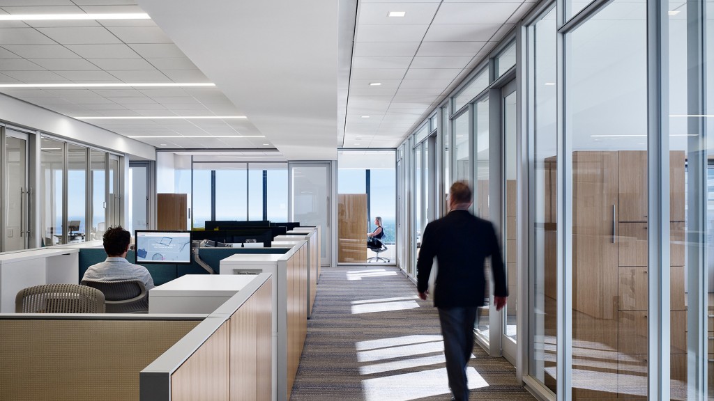 A man walking in an office.