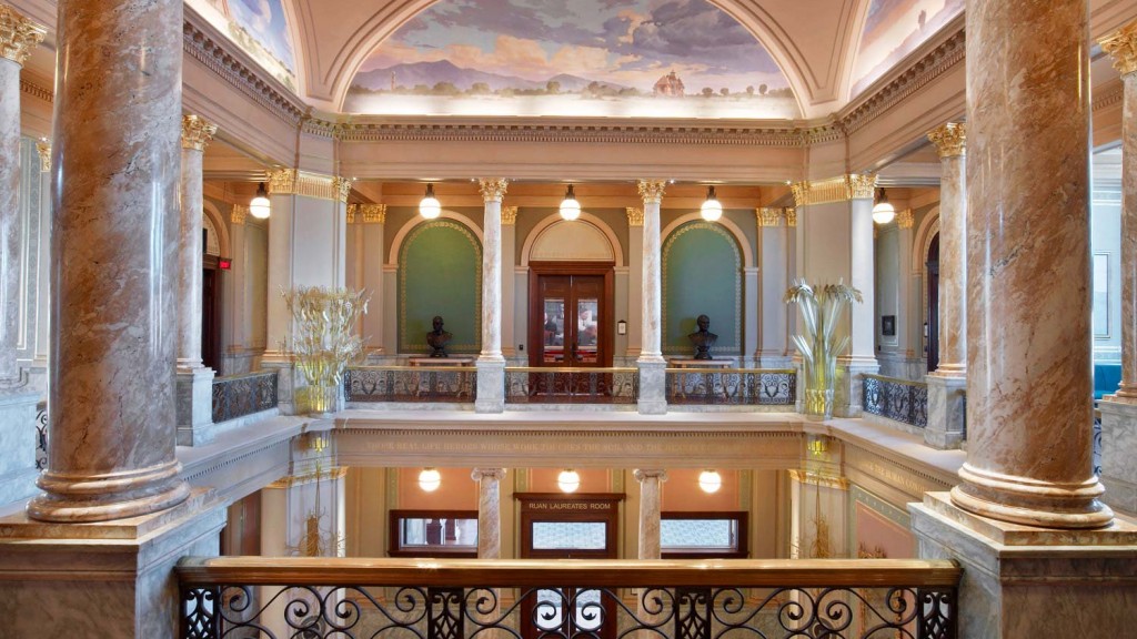 A large ornate building with columns.