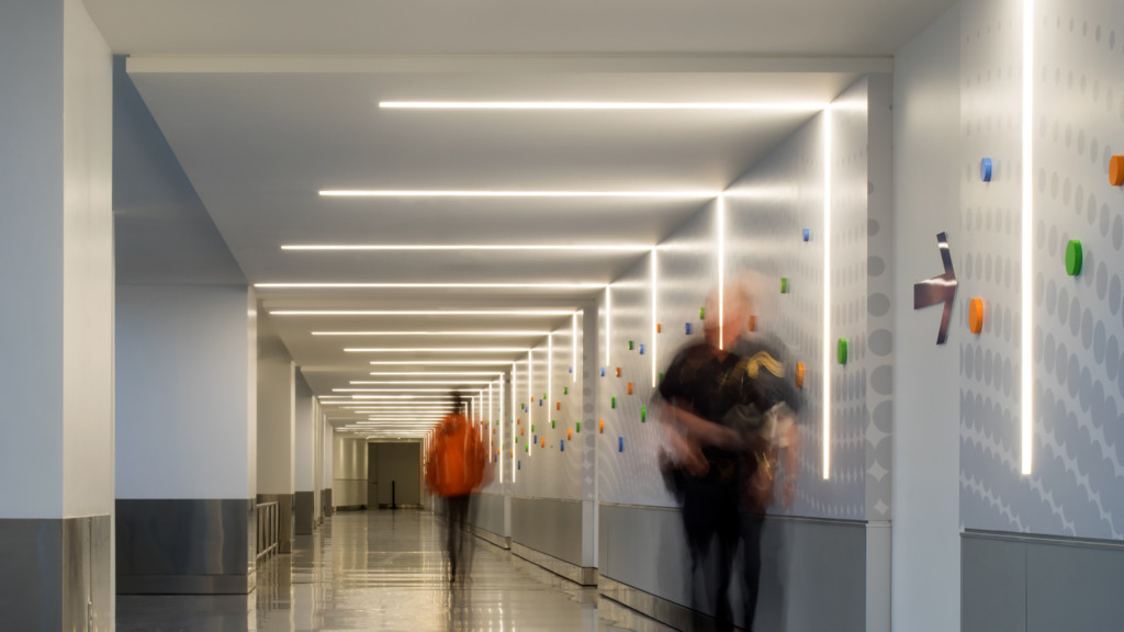 A person standing in a hallway.
