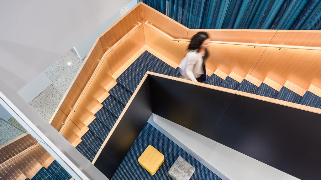 A person walking up a flight of stairs.