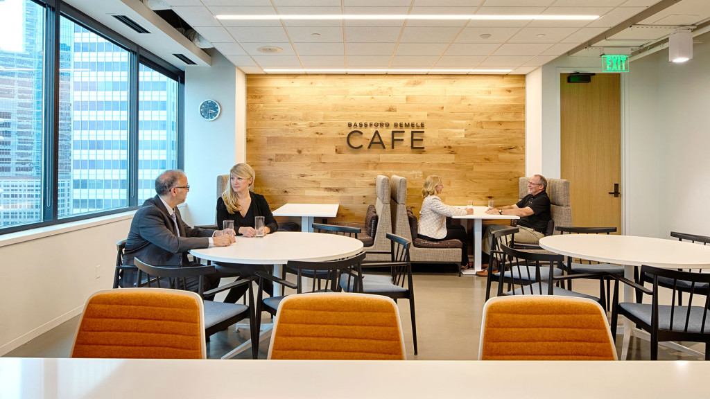 A group of people sitting around a table.