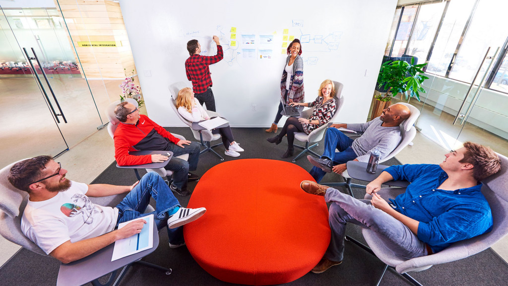 A group of people sitting in a room.
