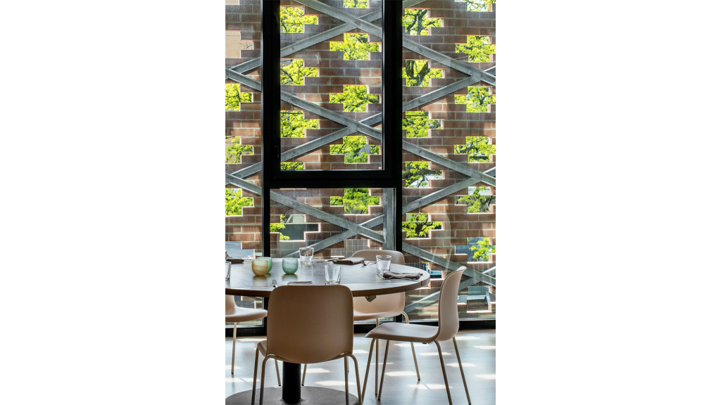 A table with chairs and a window.