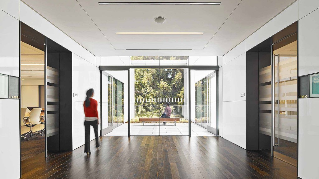 A person walking in a hallway.