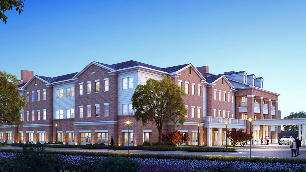A large brick building with a parking lot in front of it.